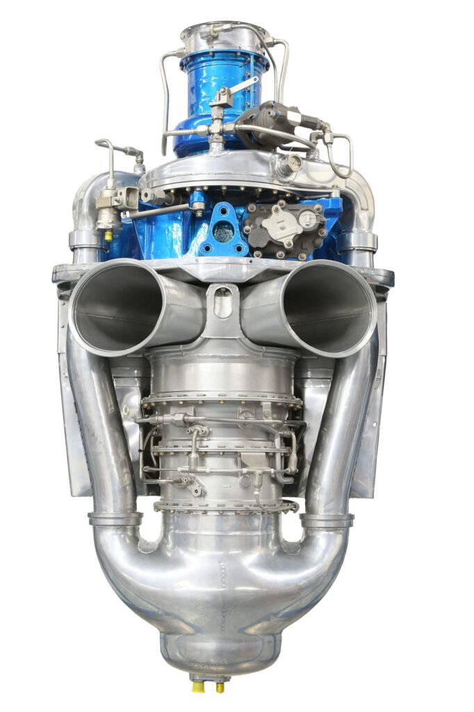 Metal engine assembly photographed against white