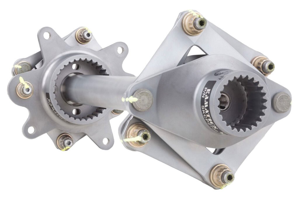 Two metal drive components with toothed shafts