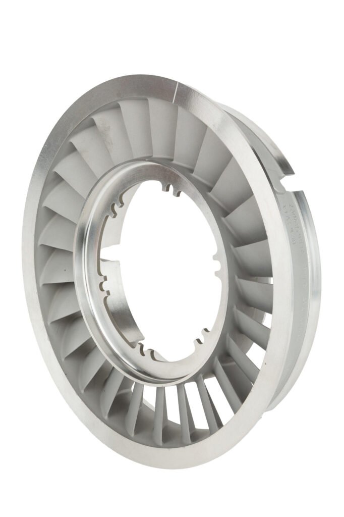 Circular metal component with evenly spaced radial blades