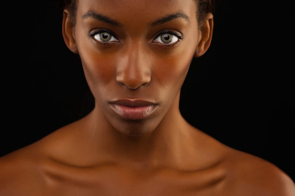 Close-up beauty portrait against a black background