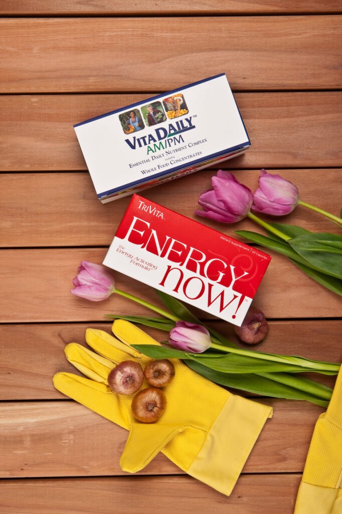 Supplement packaging arranged with tulips on a wooden table