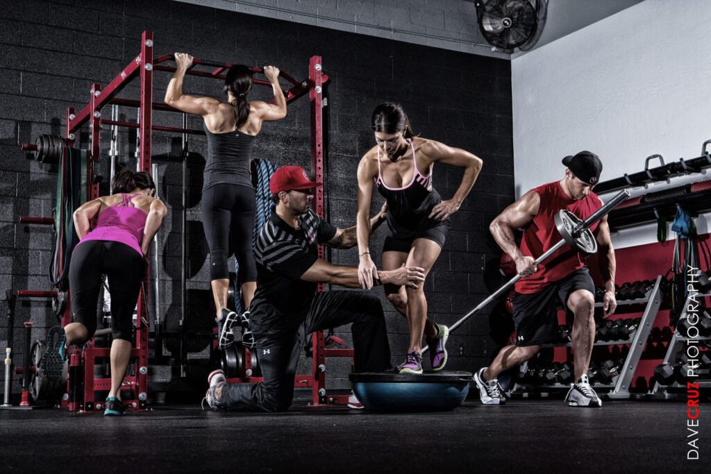 Athletes exercising together in a weight-training gym