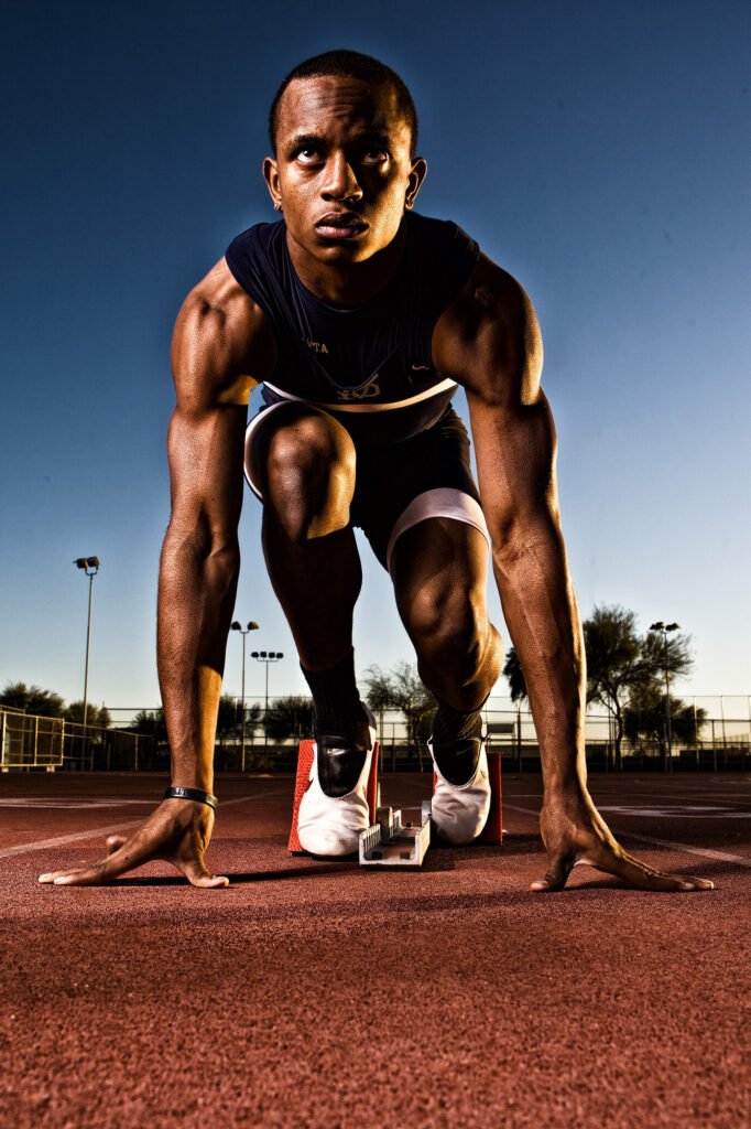 Low-angle portrait of a sprinter at the starting line